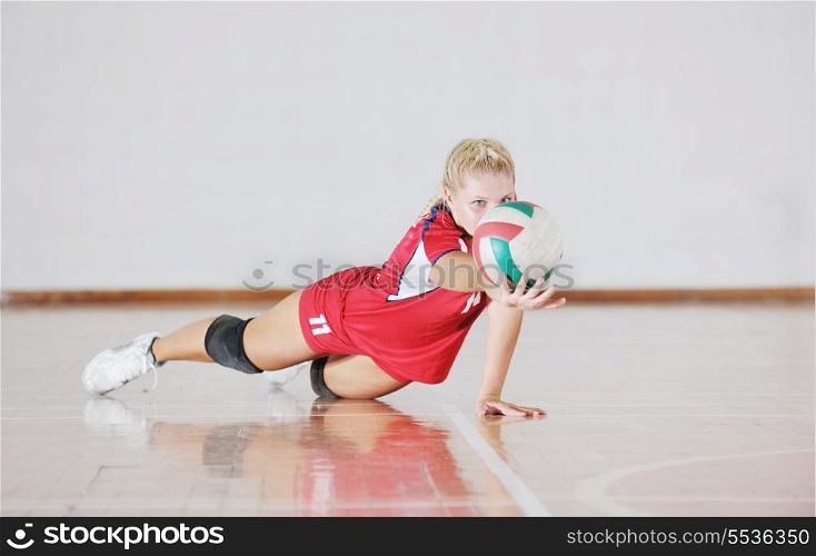 one young girl playing volleyball game sport indoor