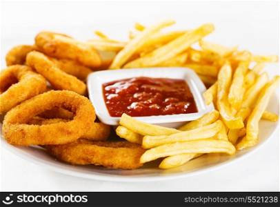 onion rings and fries on a plate
