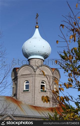 Onion shape cupola and roof of new russian church in Murmansk, Russia