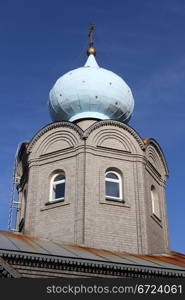 Onion shape cupola and roof of new russian church in Murmansk, Russia