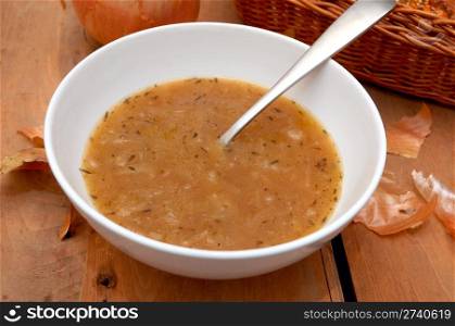 Onion Soup in Bowl on Wooden Table