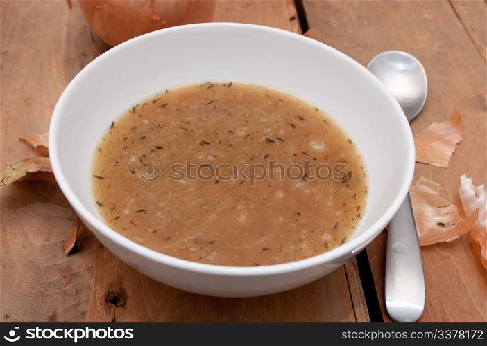 Onion Soup in Bowl on Wooden Table