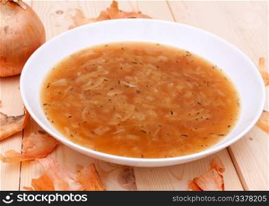 Onion Soup in Plate on Wooden Table