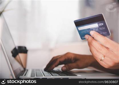 Onli≠shopπng. Woman hands holding credit card and using laptop with∏uct purchase at home, fema≤®ister via credit cards on computer to make e≤ctronic payment security onli≠