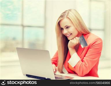 online and internet shopping concept - happy teenage girl with laptop and credit card
