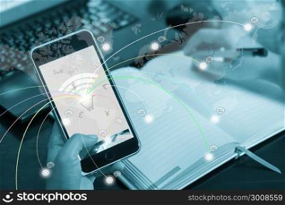 Online business concept, buying, selling, shopping. The businessman clicks on mobile touch screen. Elements of this image furnished by NASA.