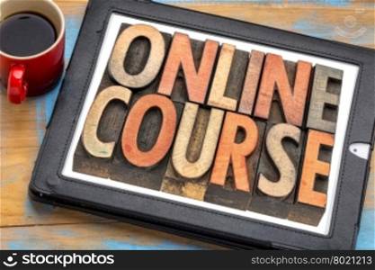 online course banner - isolated text in vintage letterpress wood type on a digital tablet with cup of coffee
