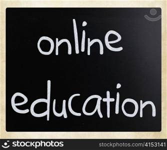 ""Online education" handwritten with white chalk on a blackboard"