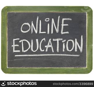online education text in white chalk handwriting on a vintage slate blackboard, isolated on white