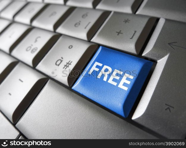 Online free web offer and Internet concept with free sign and word on a blue laptop computer key for blog, website and online business.