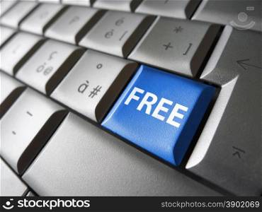 Online free web offer and Internet concept with free sign and word on a blue laptop computer key for blog, website and online business.