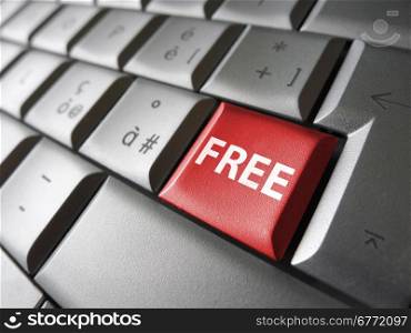 Online free web offer and Internet concept with free sign and word on a red laptop computer key for blog, website and online business.