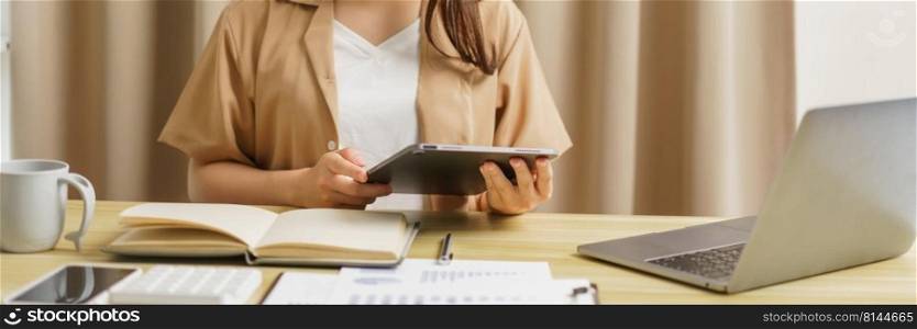 Online lifestyle concept A female staff working from home and checking the meeting report through the tablet