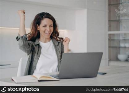 Online meeting. Successful young spanish woman has video call on computer. Excited freelancer has corporate internet conference. Lady staying home on quarantine. Remote work and communication.. Successful young spanish woman has video call on computer. Excited girl has internet conference.