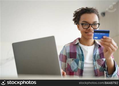 Online payment, money transfer. Handsome hispanic girl is buying online with credit card. Smiling teenager spends money through internet. Teenage girl is purchasing online. Discount in internet shop.. Online payment, money transfer. Handsome afro girl is buying online with credit card.