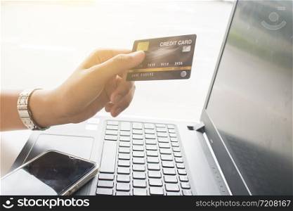 Online payment,Women hands holding credit card for online shopping.