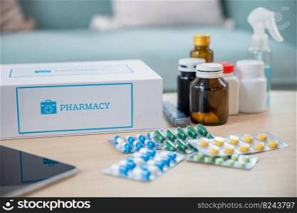Online purchase delivery of medicines to your home from drugstore, Home medicine with medicine package box free first aid kit with pills from pharmacy hospital delivery service on table in living room