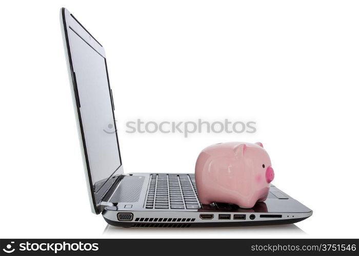 Online savings concept. Piggy bank sitting on laptop over a white background.