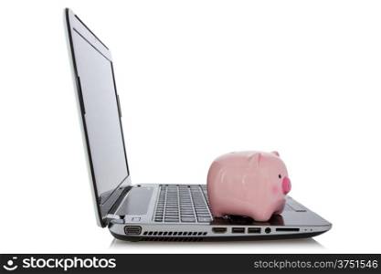 Online savings concept. Piggy bank sitting on laptop over a white background.