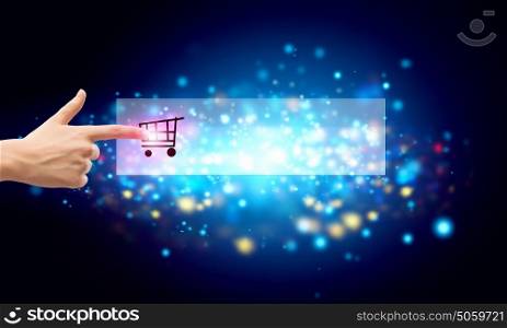 Online shopping concept with finger touching digital shopping icon. Online shopping