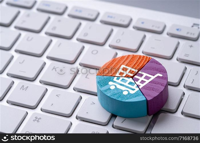 Online shopping icon on colorful pie chart puzzle