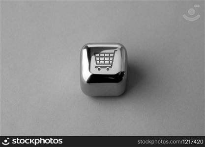 Online shopping icon on metal cube for futuristic & creative style