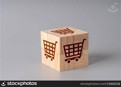 Online shopping icon on wood jigsaw puzzle for global concept