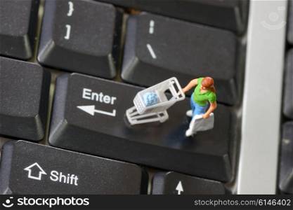 Online shopping with shopper on a computer keyboard