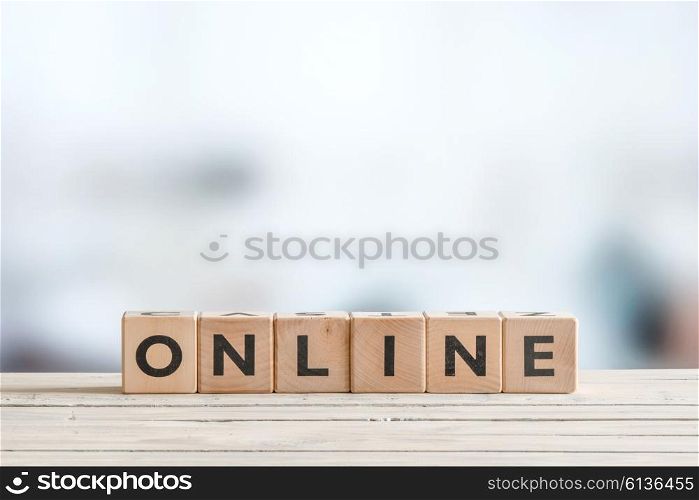 Online sign on a wooden desk om a room