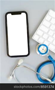 online telemedicine concept, stethoscope and pc keyboard with modern phone, medical app mock up. online medicine concept