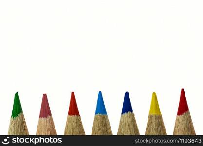only the tips of colored crayons can be seen at the bottom of the white background