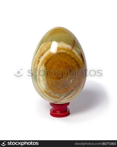 Onyx stone egg isolated on white background. Onyx egg on a white background