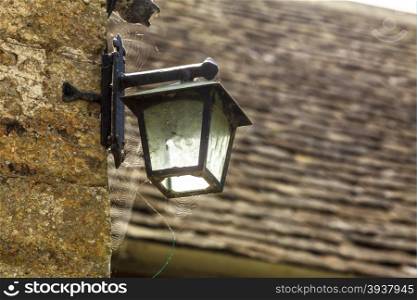 Oold lamp on the wall, iron street lantern outdoor