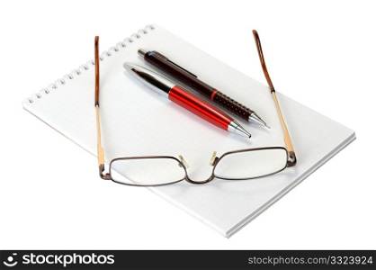 Open a blank worksheet notebook, pen, pencil and eyeglasses on a white background.