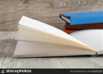 open blank notebook on wooden table