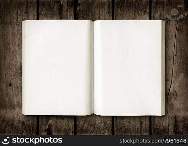 Open book on a dark wood table. Mockup. Open book on a dark wood table
