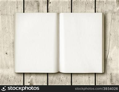 Open book on a white wood table. Mockup. Open book on a white wood table