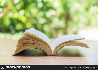 Open book on wood planks