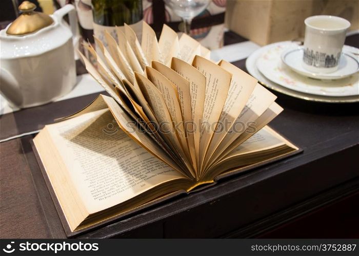 Open book on wooden table