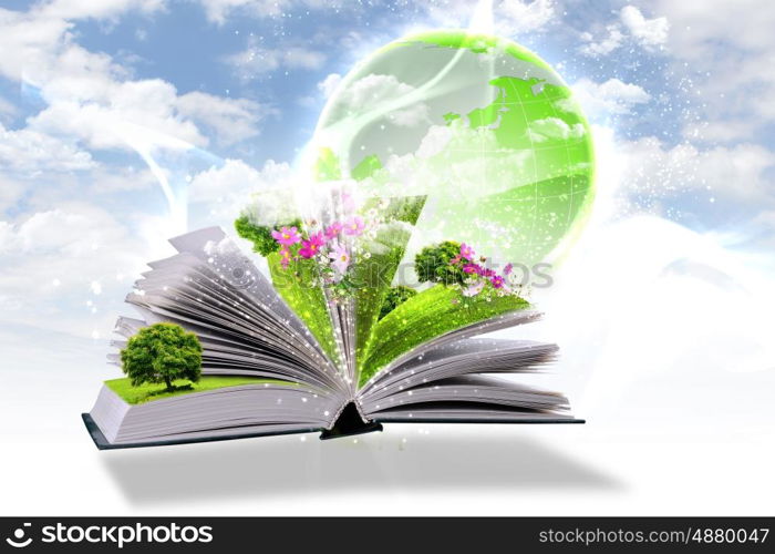 Open book with green nature world coming out of its pages