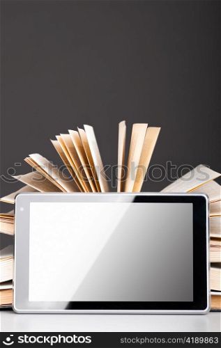 open books and modern tablet computer, concept of evolution