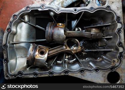Open car engine with cylinders piston and rod of used car repair