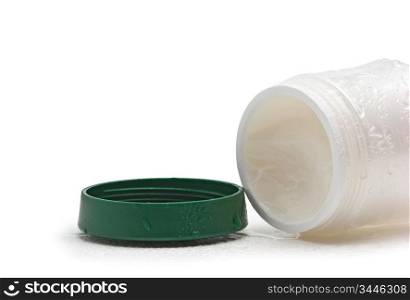 open cosmetic cream jar wet isolated on a white background