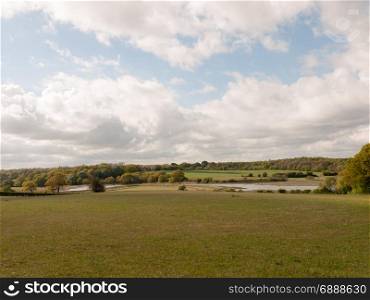 open countryside empty grassland with cloudy blue sky