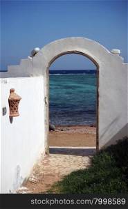 Open door on the sand beach in Dahab, Egypt