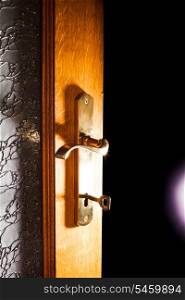 Open door with key into the dark room with light