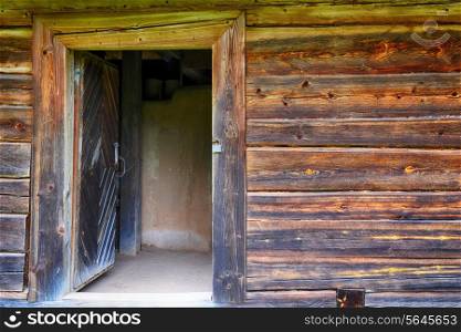 open doors in an old wooden house