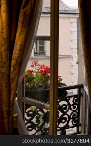 Open draped window in Paris France