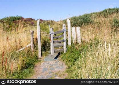 Open Gate on a pathway on Llanddwyn Island, Anglesey, Wales