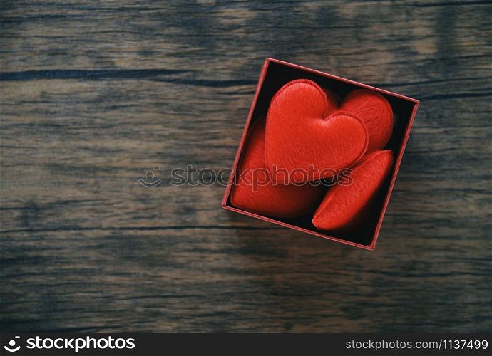 Open Gift Box and red heart romantic in box surprise / red present box with full heart for gift to Merry Christmas Holiday Happy new year or Valentines day on wooden rustic texture background